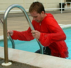 pool boy with anorak in pool