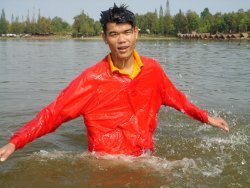 Swimming in windshirt and polo shirt in the lake