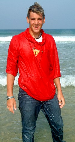 Soaking wet red hoodie on the beach.