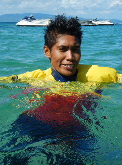 happy jetski boy swimming in an anorak